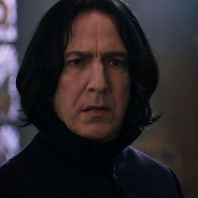 There, his black robes rippling in a cold breeze, stood Severus Snape..