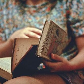 she reads books as one would breathe air, to fill up and live