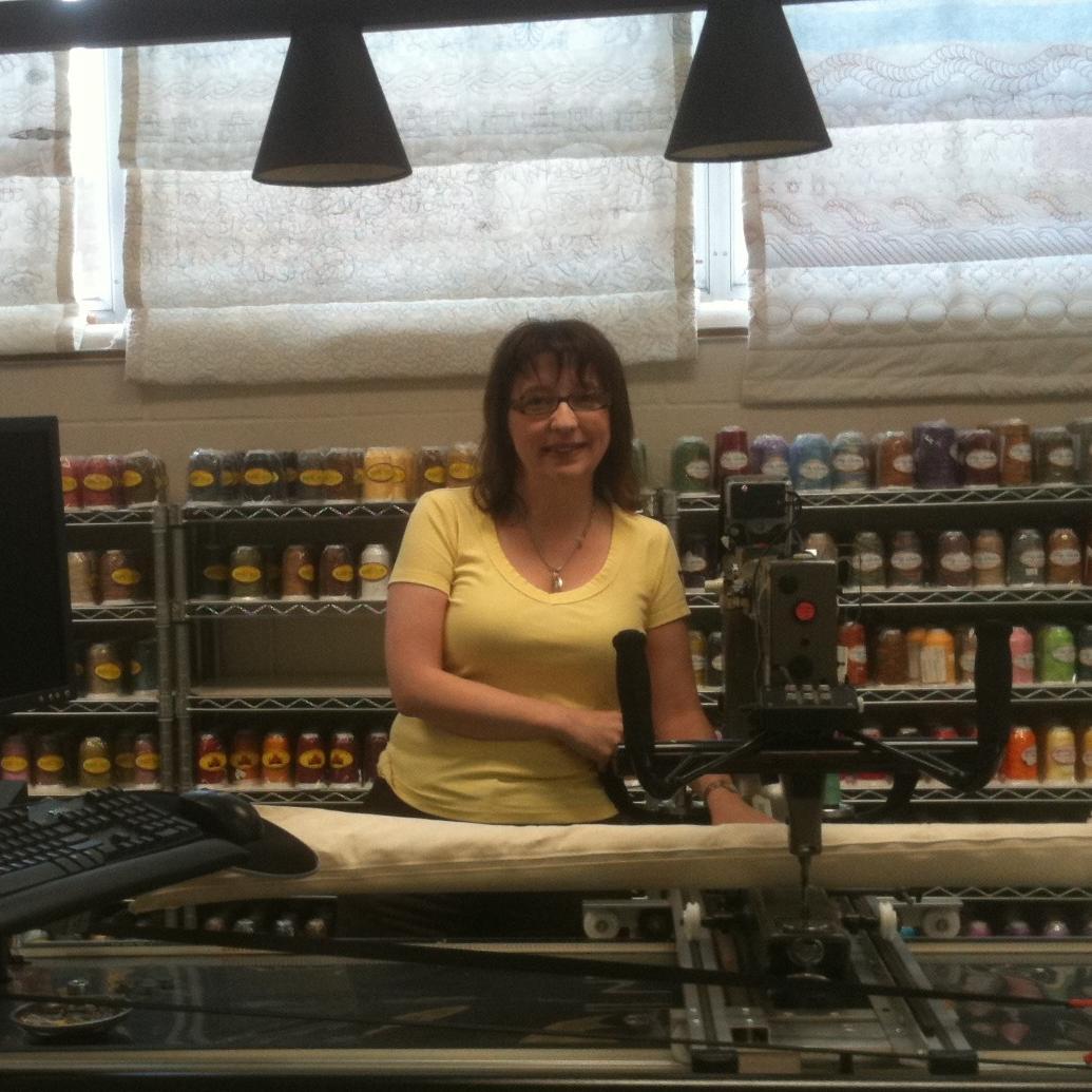 I love all things fabric and I wear many hats in the quilting world: I am an independent fabric and notions rep, a longarmer, and the manager of the Milwaukee C