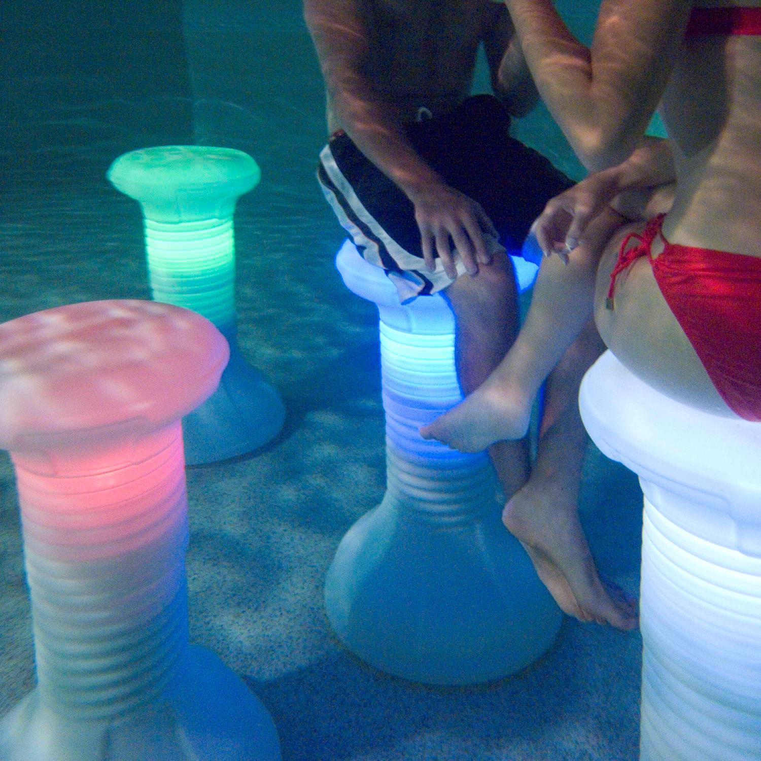 The Pool Stool is a height adjustable bar stool for inside the swimming pool equipped with a remote controlled rechargeable LED. It's better than standing!!!