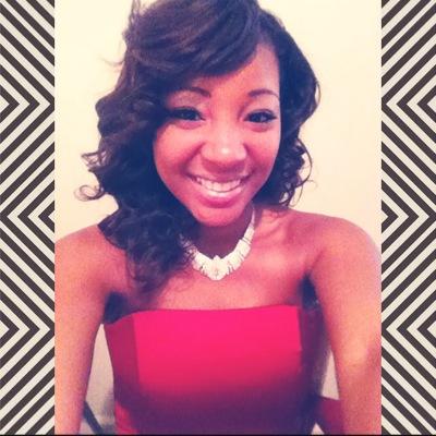 a Lady whose smile is open & expression is glad.  IG: adalis_bynum