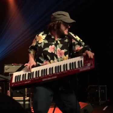 Keyboard player with a taste for funky shirts and bad puns.