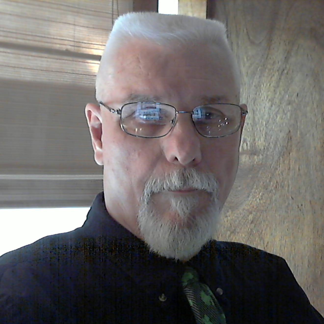 Seventy-three years old; writer of mystery and fantasy novels. And like most struggling artists-- in need of a loan, and a publisher who actually likes my work.