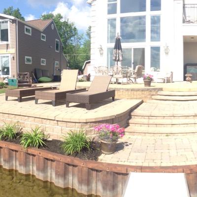 Local family hardscaping company that makes gorgeous additions to your home with firepits patios seating walls driveways and repairs of older patios