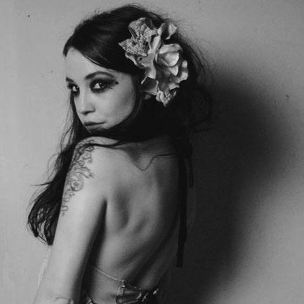 FlutterbyNat's profile picture. I dream up dresses for petals...