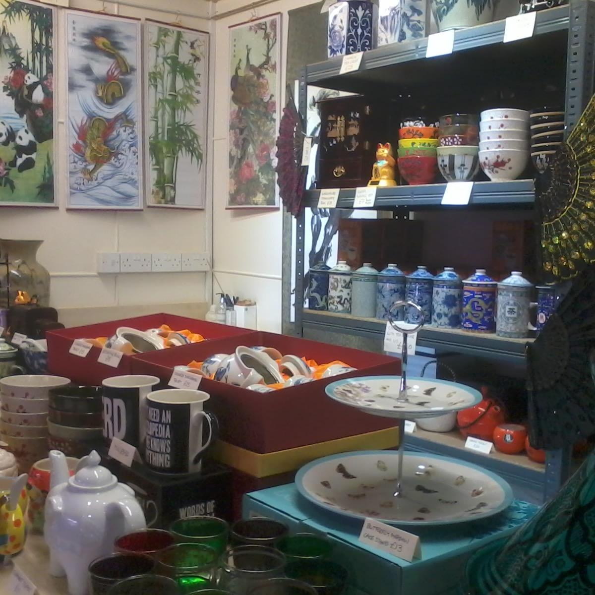 Eclectic mix of ceramics, glassware & tableware with other bits and bobs; part crockery, part oriental/Chinese goods shop.