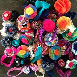 Custom-made headbands, necklaces, brooches, bowties, flower lapels, shoe clips, & baby blankets in fun prints & vibrant colors for children and adults.