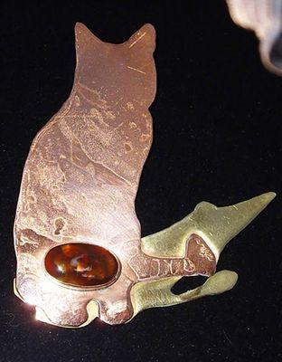 I make handcrafted jewelry in Sterling Silver (925), Brass, Copper, and PMC (Fine Silver). I can also include Gemstones, Minerals, or Fused Dichroic glass.