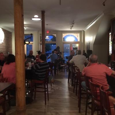 A unique restaurant and bar in Courtyard Square, a charming group of turn of the century buildings with restaurants and retail around a central courtyard.