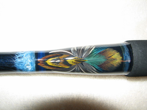 I build custom fishing rods with exotic wood grips and insect inlays.  Specialty rods also feature intricate feather inlays, custom decals, and  marbleizing.