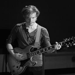 Guitarist, producer, songwriter. My hair is the source of all of my power.