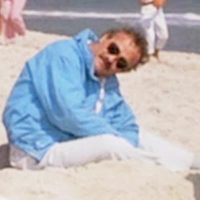 MitchelEugene's profile picture. black blue and green