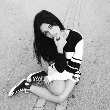 She got the eyes of innocence.The face of an angel.A beautiful smile.That hides pain.