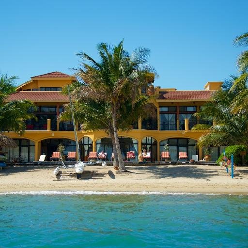 Villa Verano is a luxurious 10-room villa located on the beach in Hopkins, Belize, offering full-service amenities, pool, interior courtyard and garden.