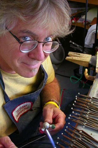 Artist working in the mediums of sculpture and jewelry