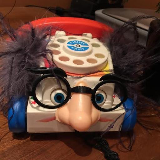 Doctor of Pedantic Therapy - currently embodied inside a toy phone