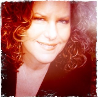 Creative Director, owner of The Uzee Collective, batik artist, jewelry designer, yogi, meditator, lightworker, wife, mom and generally happy person