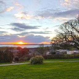 Caravan and camping holidays/organic farm in outstanding area of natural beauty on the south Cornish coast. Stunning sea and countryside views.