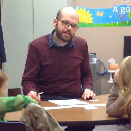 Just a guy teaching kids to read and knitting copious numbers of hats.