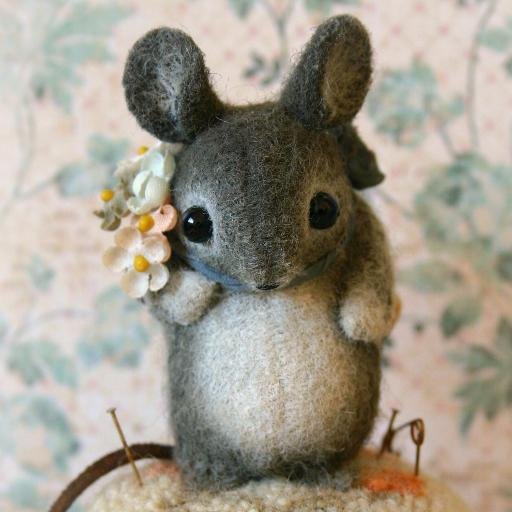 Mixed media artist who specializes in creating old world style miniature wool felt characters.