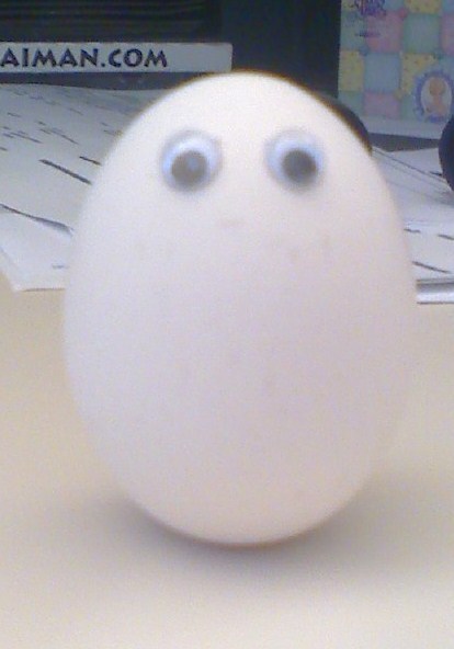 a little egg trying to make it as part of a big omlette