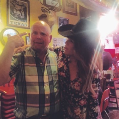 ashtonburton's profile picture. The girls in the flower crowns are staring at me