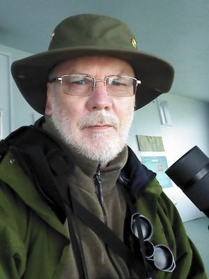 A birdwatcher living in Norfolk, who takes photographs of birds and other wildlife when the opportunity arises.