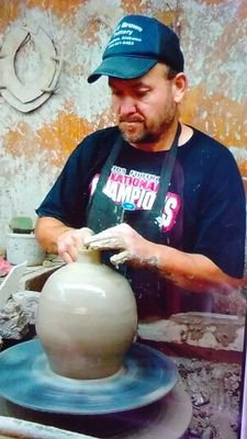 Folk pottery artist at browns pottery and sons. 10th generation. continuing tradition.