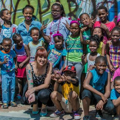 'Sidewalk Sessions - free guitar lessons'- Guitar lessons for children in the community,Sunday afternoons at Maboneng Precinct, South Africa with Kelly Grevler