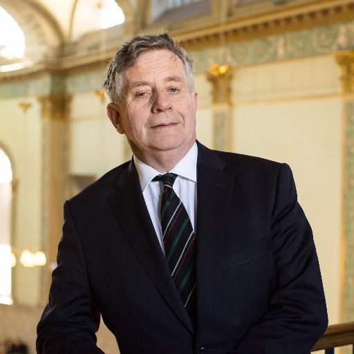 Associate Professor of Economics and Fellow of Trinity College Dublin and former Senator in Seanad Éireann.