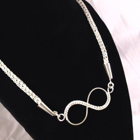 TightlyWrapt's profile picture. Husband and wife team of jewelry makers. He makes the rings and cabochons, she does the wire wrapping and networking. A perfect match!