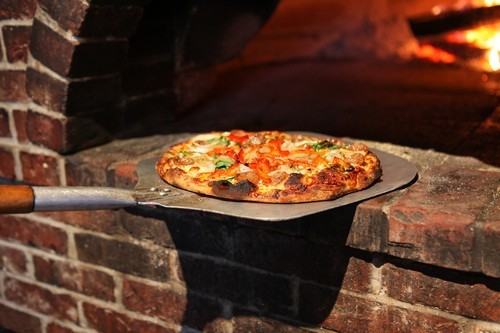 Mouth-watering wood-fired pizzas, Italian specialties, and great beers on tap all served in a friendly atmosphere!