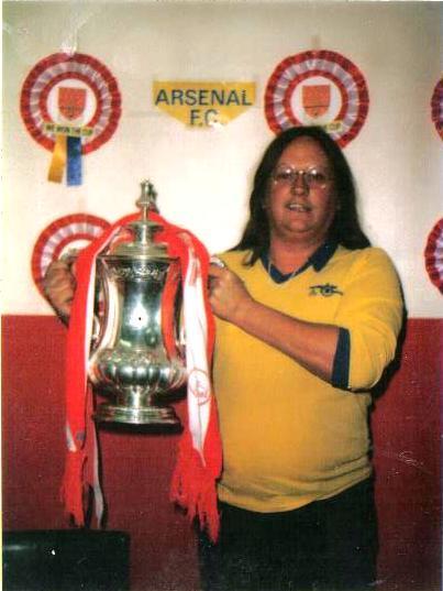 Lifetime Arsenal fan. First game in 58. That's me with the Cup after the 71 Double. Blessed with a beautiful filipina wife and 3 boys, all Gooners of course !