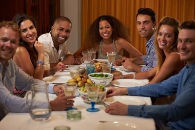 To take the common bond of eating, cooking, and talking as a way of promoting understanding and acceptance among groups and different cultures.