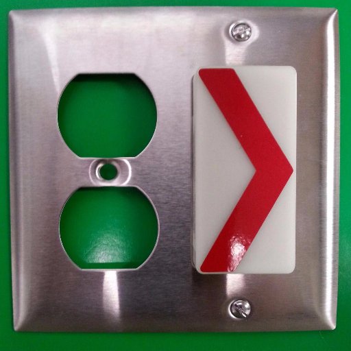 exit sign for electric outlets at floor level. UNDER THE SMOKE