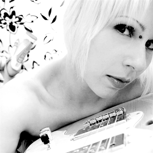 Singer/Songwriter/Guitarist/Pianist/Ponderer/Geek/Bookworm/Film Junkie/Shoe Fetishist/