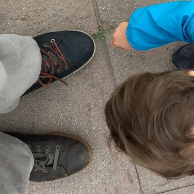 Me and my 3 y old son pointing I wear two different shoes by mistake. Horizontal photo-me on a protest (2013)