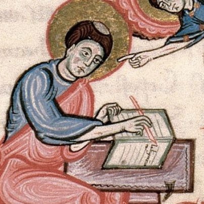 A guy with a pen and some parchment.