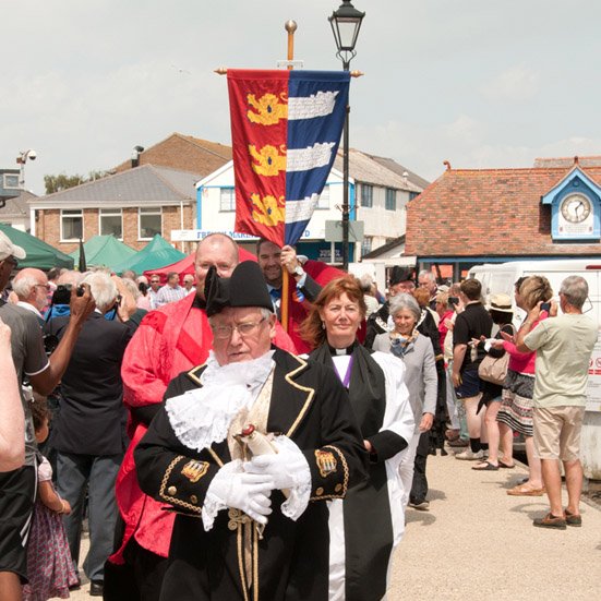 Blessing of the Waters, annual centuries old tradition at the Cinque Port Liberty of Brightlingsea, Essex. Procession to Hard, Blessing from sailing smack