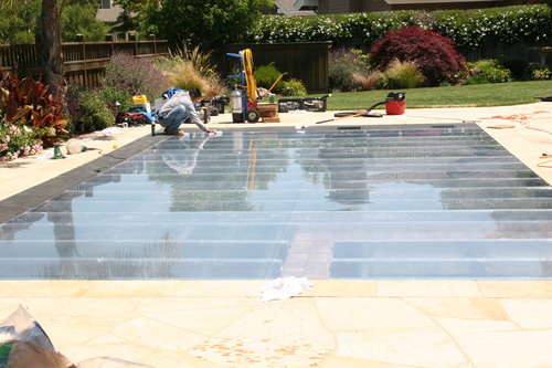 we cover pools with clear Acrylic, plywood, carpet, dance floors, basketball court or just to gain space. glass