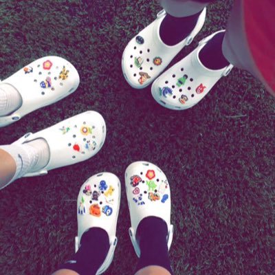 white crocs with stickers