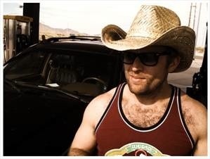 Guy with a cowboy hat and a tank top. Also, executive producer of MOCKpocalypse on AXS TV, member of Dr. God comedy group, the Lusty Horde and the Friday 40.