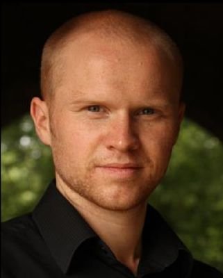 Bald, ex-ginger, nickname - 'fieryred'. Occasional Theatre Director, Actor, Compere