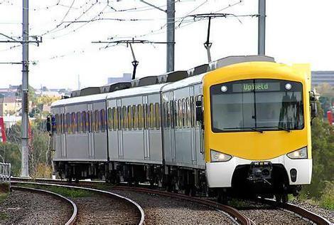 Sydney Trains operates _____, _____ and _____ trains in the greater Sydney suburban area.