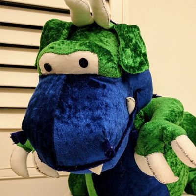Big, silly, green & blue plushy dragon here. I sew other unique & cuddly dragons! However, I am the cuddliest of them all!
