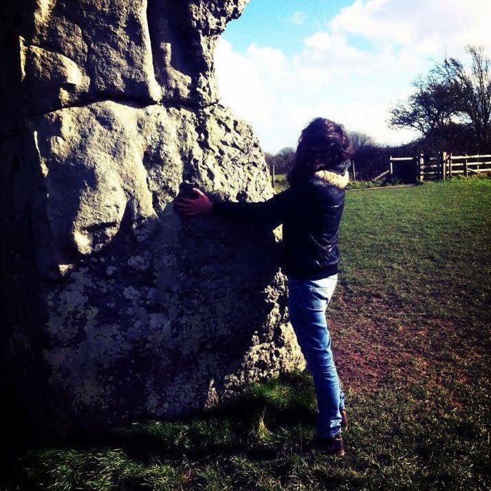 Caressing a Neolithic henge monument.