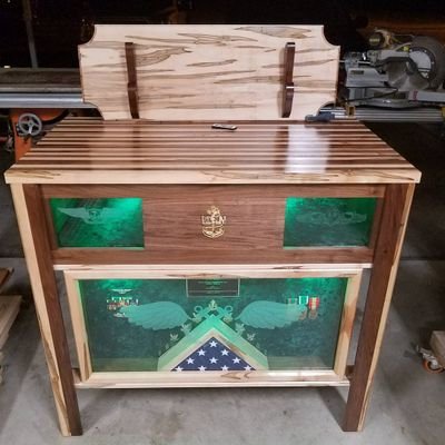 Custom wood worker.  Specializing in custom made retirement shadow boxes and challenge coin holders.