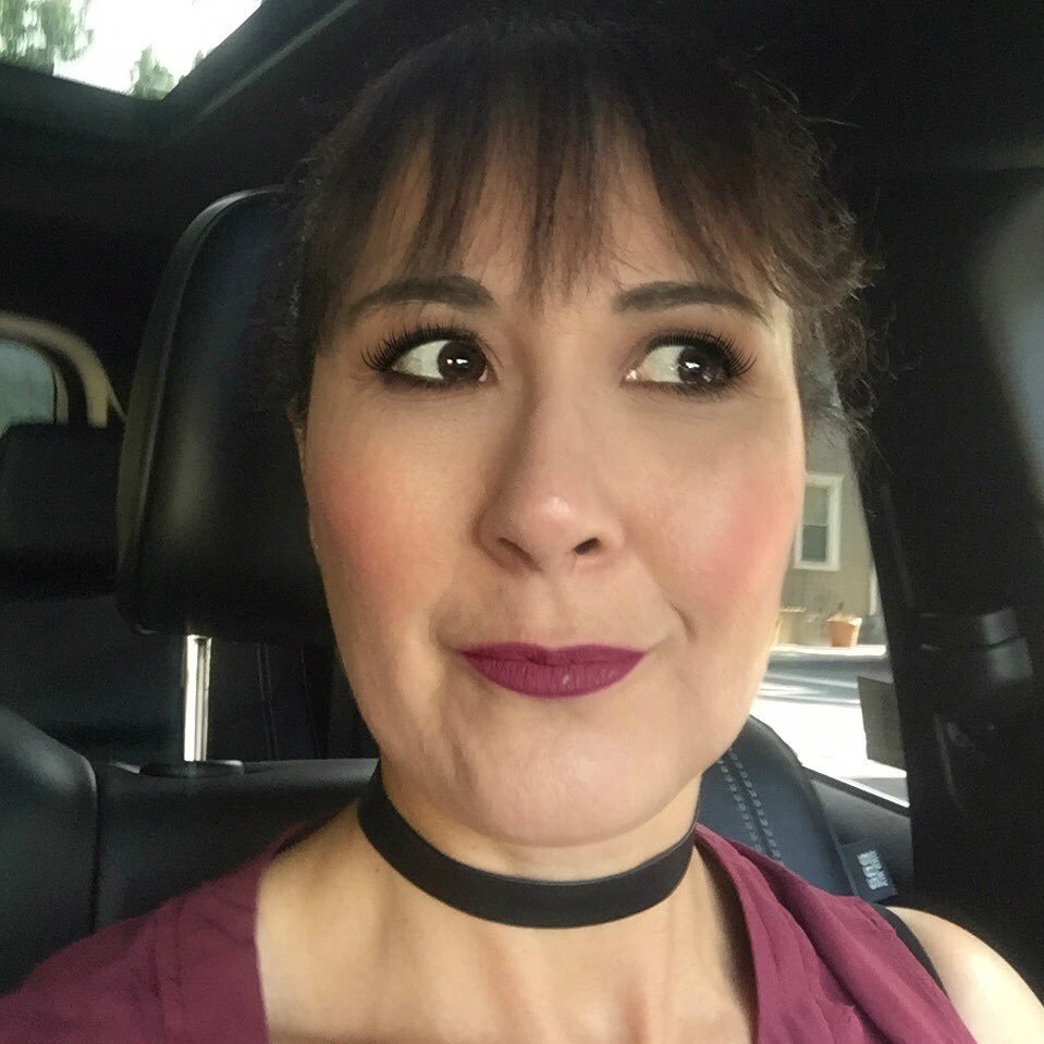 Mom of two amazing sons, wife, scrapbooker, web & computer graphics designer and an all around crazy girl as my husband likes to call me. Thoughts are my own.