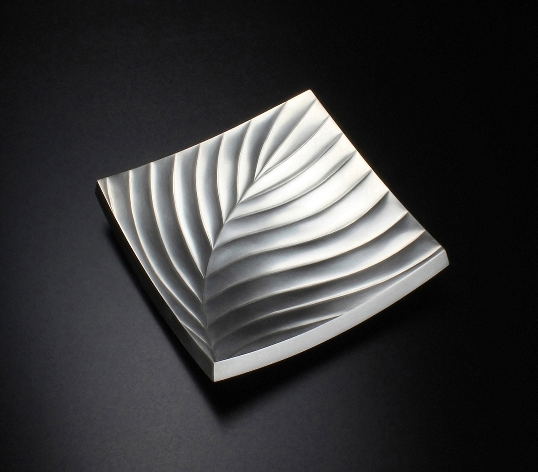 A contemporary designer silversmith based in London, creating elegant limited edition and bespoke silverware.