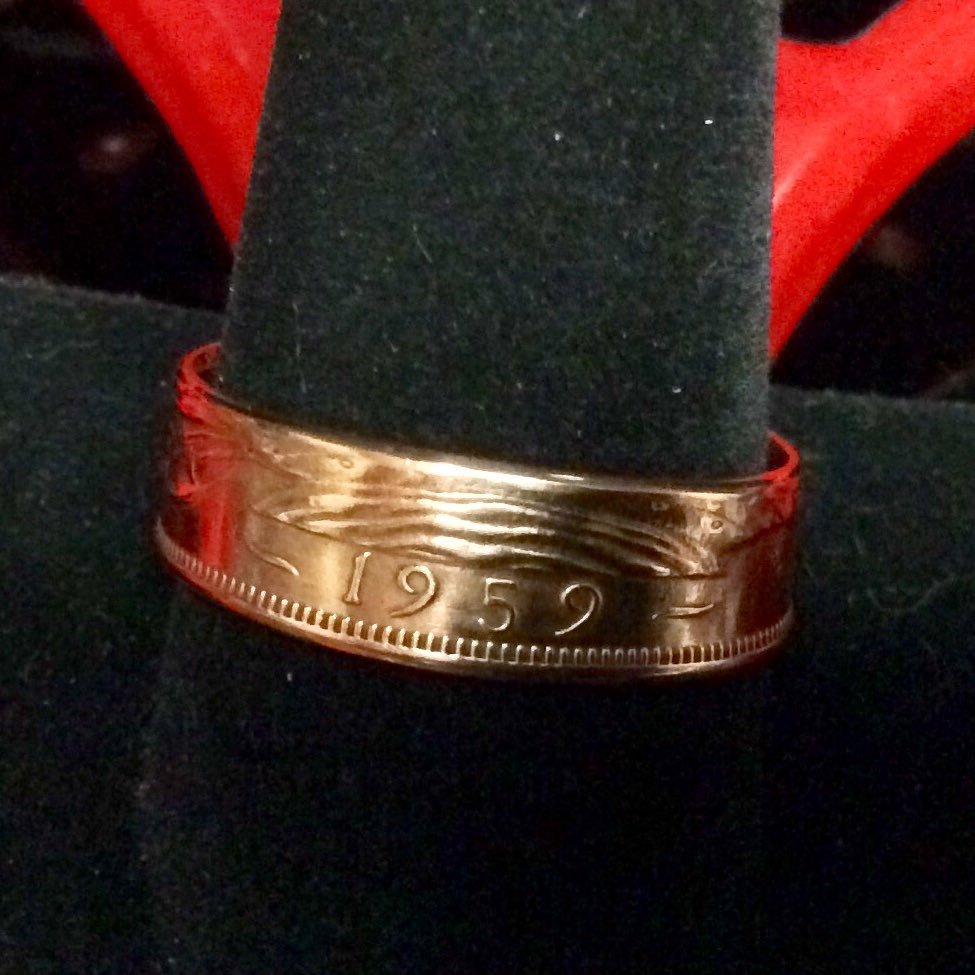 Coins have been made into rings for years.The first ones were a product of difficult times of war and or economic difficulties.